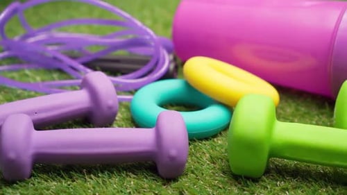 Fitness Equipment Set on Green Grass Close Up