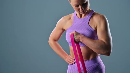 Woman Doing Bicep Curl With Resistance Band