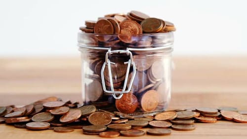 Close-up of coins in bottle