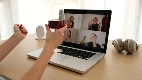 Women Video Chat and Toast Wine Glasses