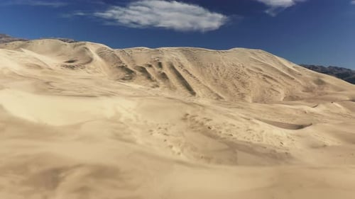 Aerial Establishing Drone Flying Fast Above Sand Dune with Desert Wilderness
