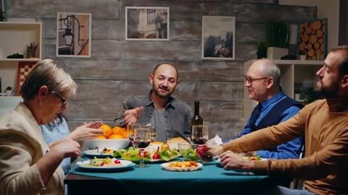 Family Dinner Celebration with Toasts and Laughter
