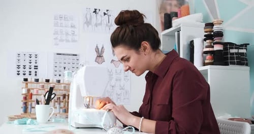 Seamstress Working in Her Atelier Studio with Sewing Machine