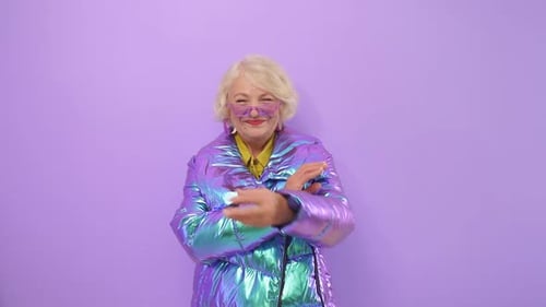 Smiling Senior Woman Posing in Puffy Coat