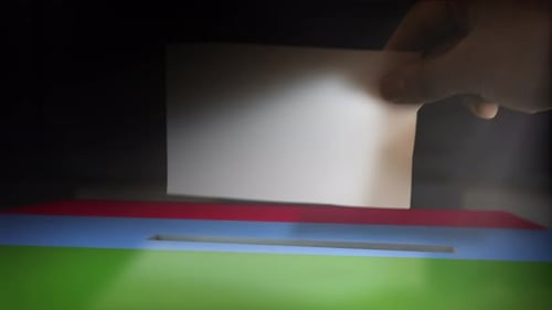 Hand Inserts Ballot into Election Box Animation