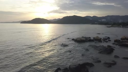 Sunset at rock stone near coastal