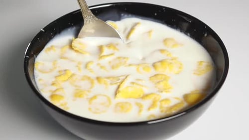 Cereal in Milk with Spoon Close Up