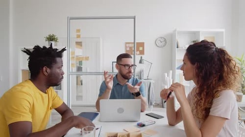Diverse Team Collaborating at an Office Table