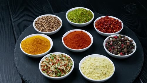 Assorted Spices in Bowls on Slate Platter