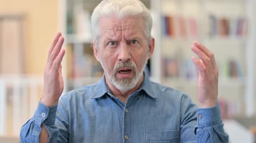 Senior Man with Angry Expression Gesturing