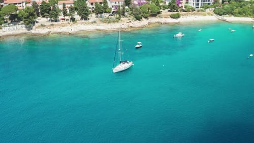 Yacht and Watercraft Drift Near Hotel Buildings at Resort