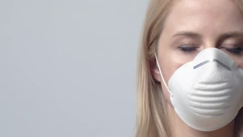 Woman Wearing Protective Mask Against Gray Background