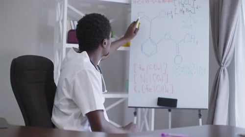 Man Explains Chemistry on Whiteboard
