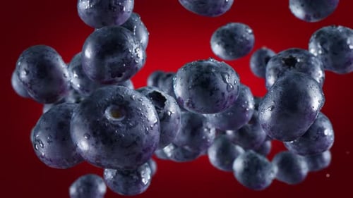 Close-up of Fresh Blueberries on Red Background