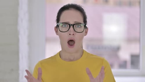 Shocked Woman Reacting with Surprise and Fear