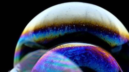 Multicolored Rainbow Colors of a Single Soap Bubble That Looks Like a Fantasy Planet Isolated