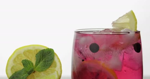 Pink Drink Garnished With Mint and Lemon