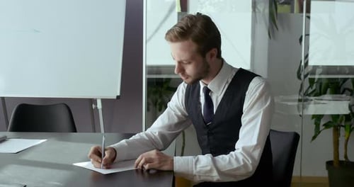 Caucasian Business Men Leader Sitting at Table in Modern Office Home Showing Thumbs Up at Camera