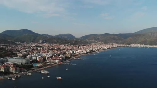 The Camera Flies Along the Coast of the City Beach in the Mediterranean Sea. Aerial View