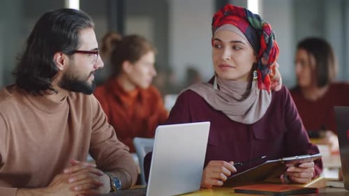 Professionals Collaborating in Modern Workplace Office