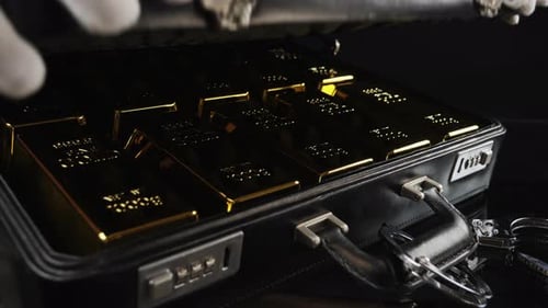 Handcuffed Suitcase with Pure Gold Bars