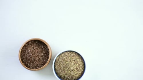Flax Seeds in Bowls on White Surface