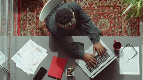 Top Down Portrait of African American Businesswoman at Office Desk