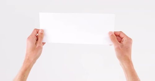 Man hand holding white blank paper