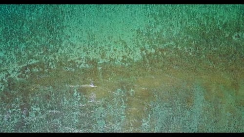 Aerial scenery of luxury coastline beach lifestyle by aqua blue sea with white sandy background of a