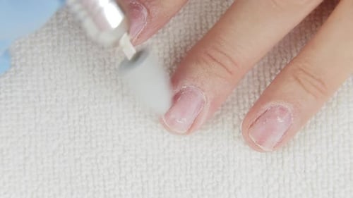 Hand with Glove Filing Natural Nail Close Up