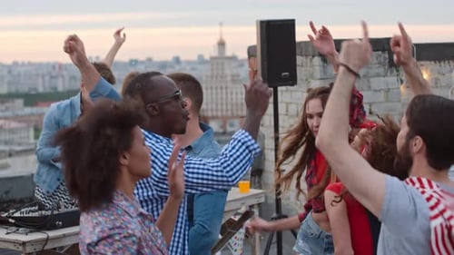 Young Adults Dancing at Rooftop Party