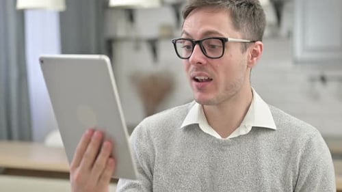 Man Talking on Tablet Video Call