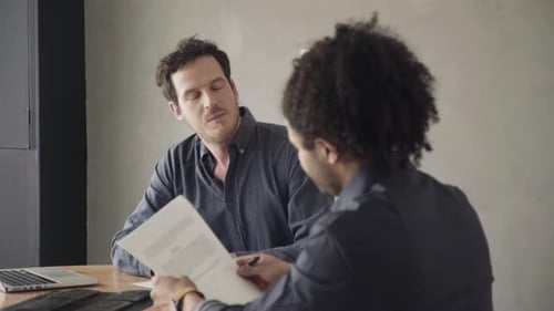 Man reviewing and signing document