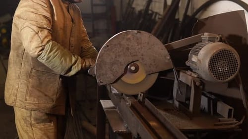 Close Up Shot of Men's Hands Who Sharpens a Metal Stick, the Sparks Fly To Sides