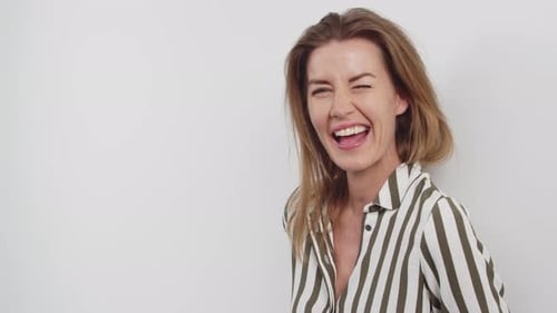 Woman in Striped Top Laughing