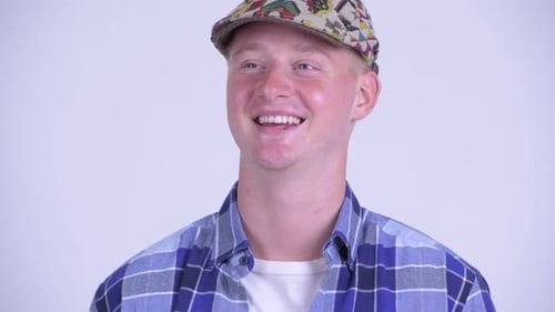 Face of Happy Young Handsome Hipster Man Thinking