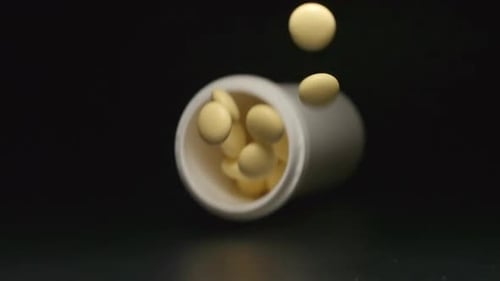 Plastic tube falls and pills fall out of him