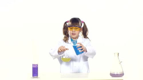 Girl in Lab Coat Pours Colorful Chemicals