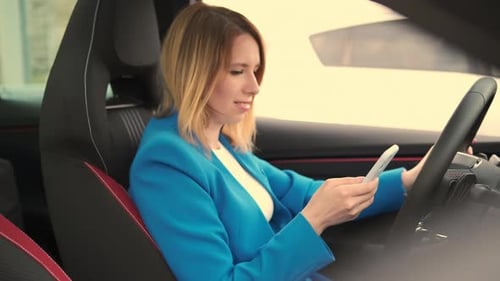 Woman Using Smartphone Inside Modern Car