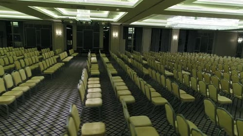 Empty Conference Hall With Rows of Chairs