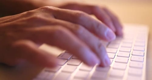 Typing on laptop computer