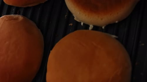 Burger Buns Toasting on Grill at Home