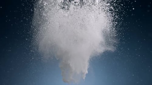 Abstract Explosion of White Powder on Blue