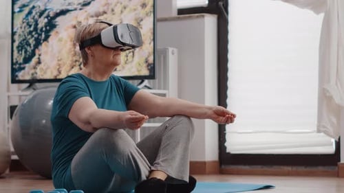 Senior Woman Using VR Headset for Home Fitness