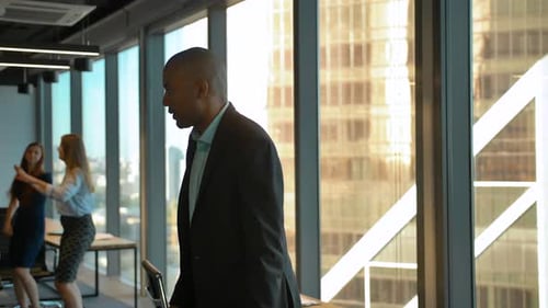 Aframerican and Caucasian Entrepreneurs Dancing at Coworking Office