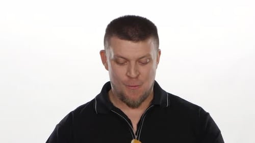 Man Enjoys Delicious Burger in a Close Up Shot