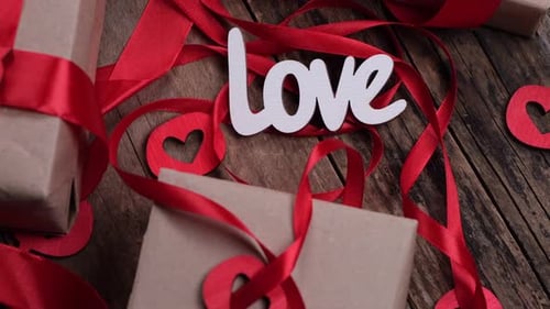 Gifts Wrapped with Red Ribbons for Wedding Anniversary