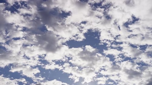 Clouds Drifting Slowly in a Blue Sky