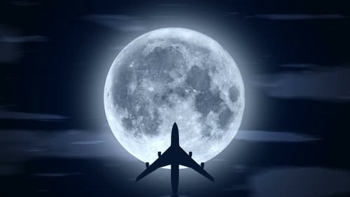 Passenger Airplane Flying Over Moon in Cloudy Night