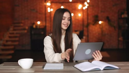 A Woman is Sitting in Her Home Office